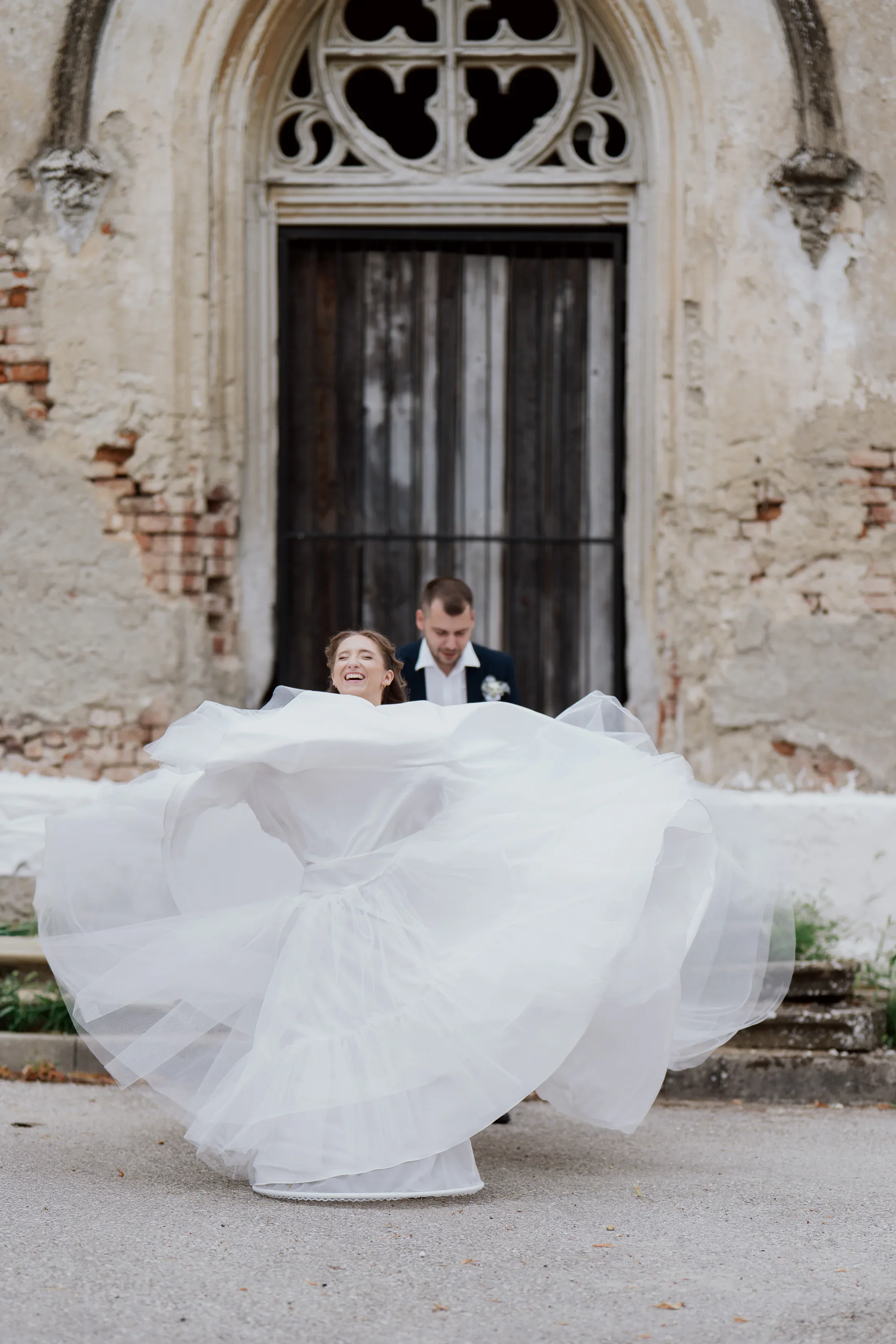 Bride twirling her wedding dress